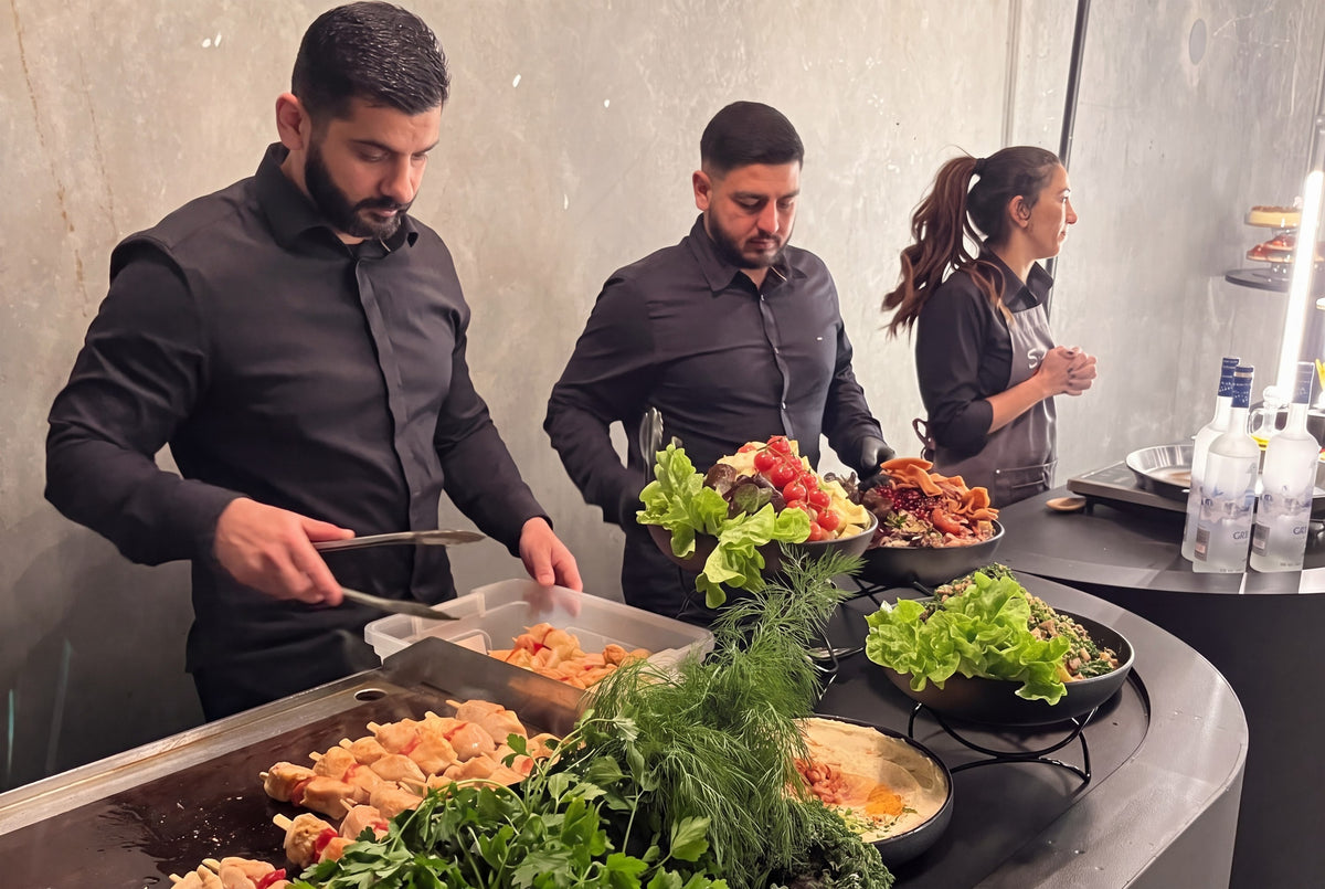 Sammy's chefs cooking at a live station