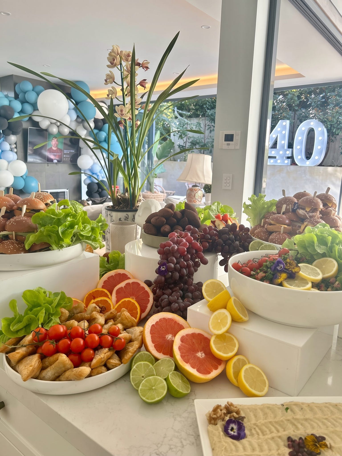 A fruit and salad grazing spread at a 40th birthday